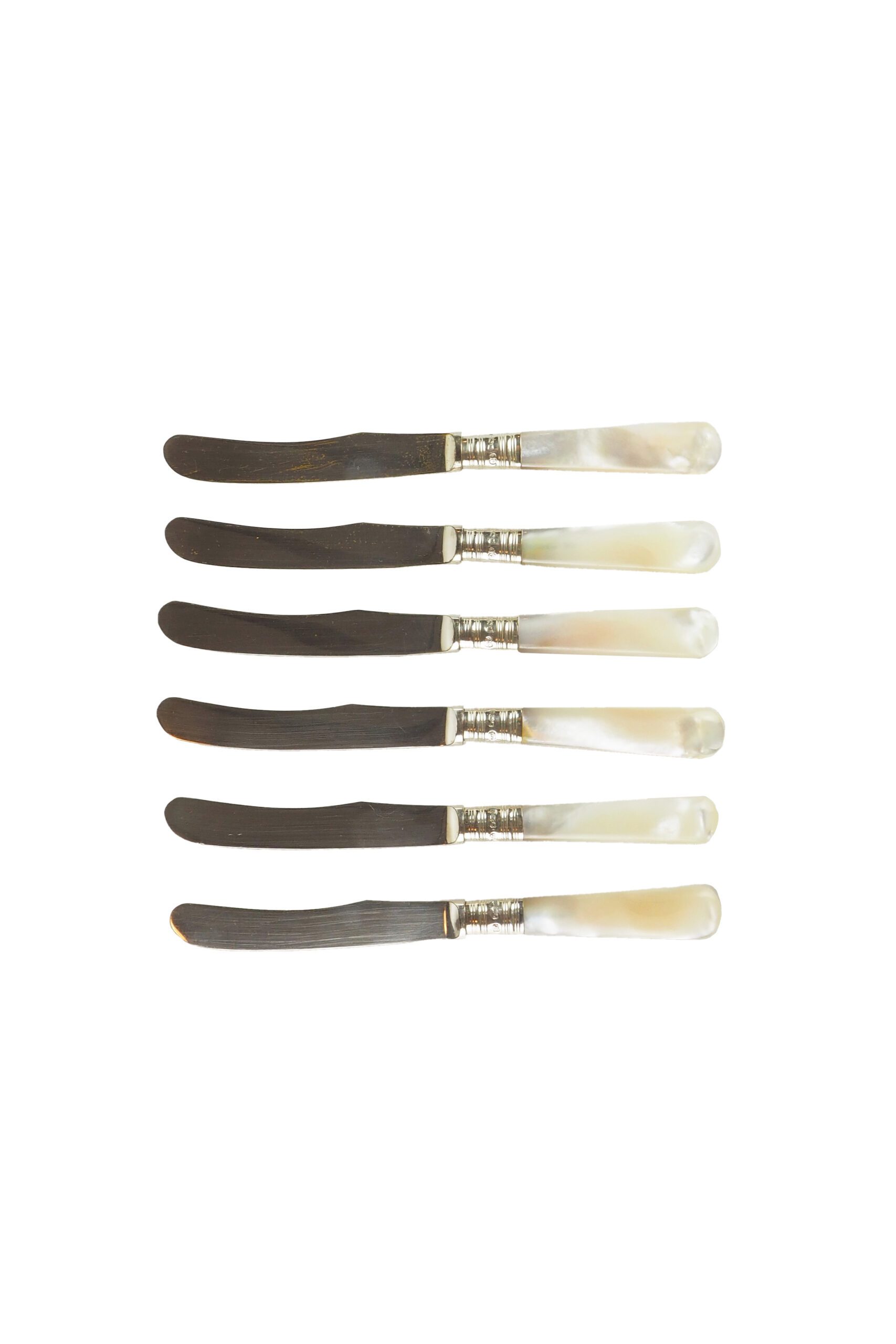 Antique silver and mother of pearl butter knives