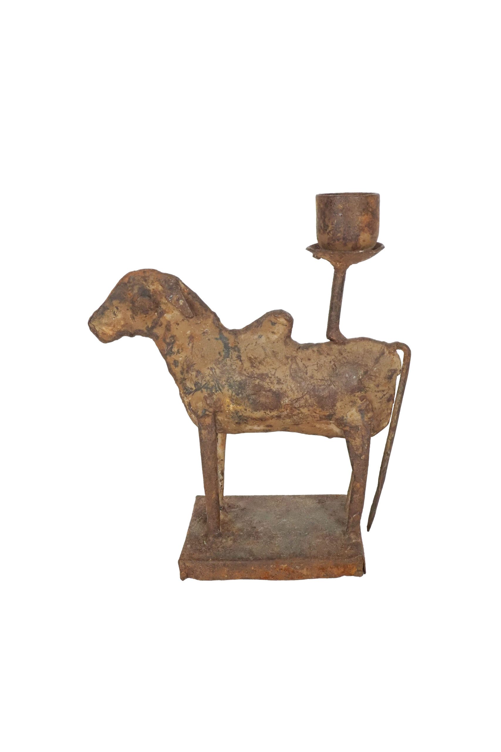 A Folk Art Cow Candlestick. This characterful Indian metal deer is hand crafted from reclaimed rusty metal. Sourced by Wildmore.