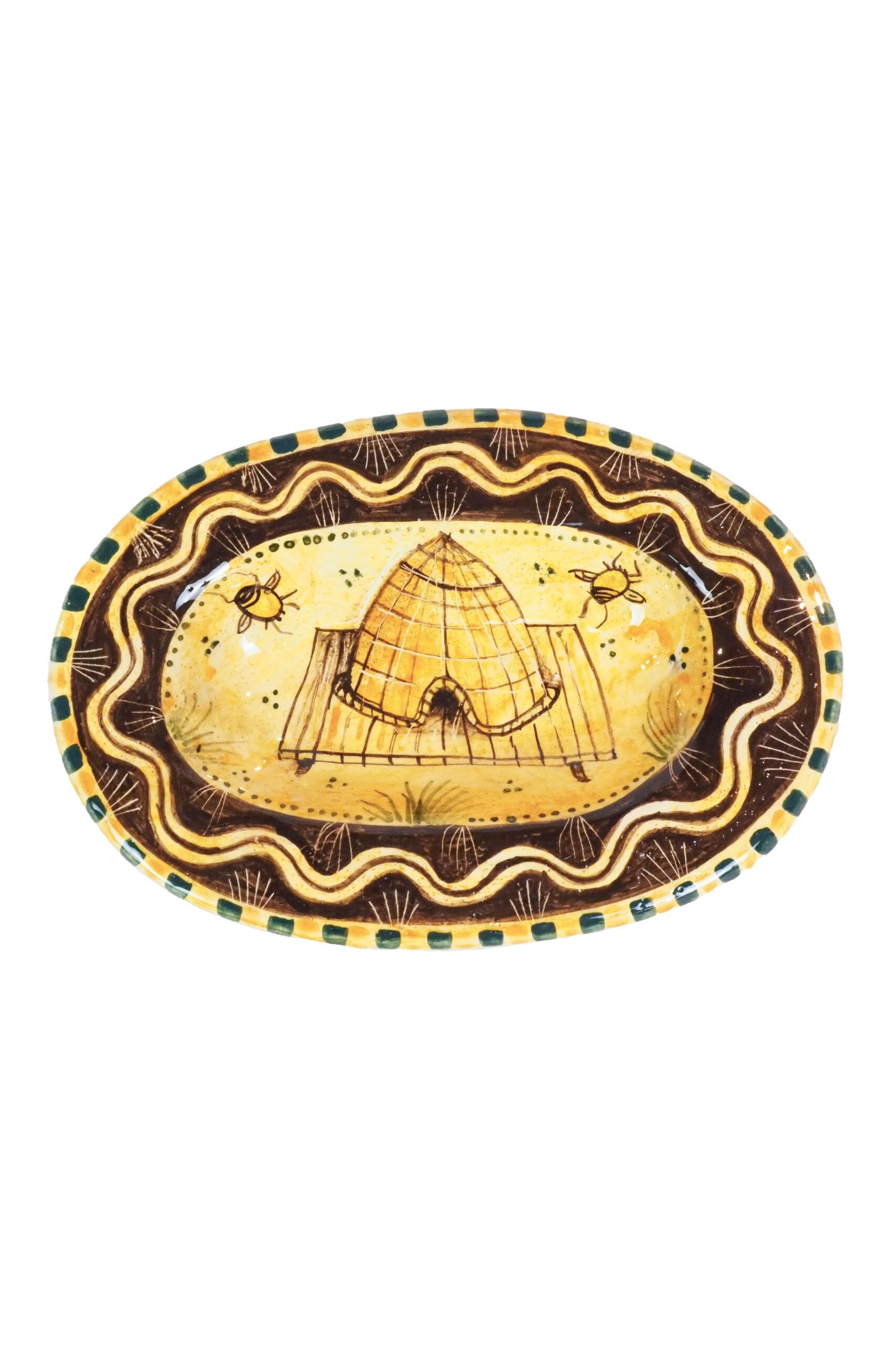 A Pottery Oval Bee Dish featuring a busy hive of bees and their bee skep. Exclusively hand moulded and decorated by Shun Clark for Wildmore.