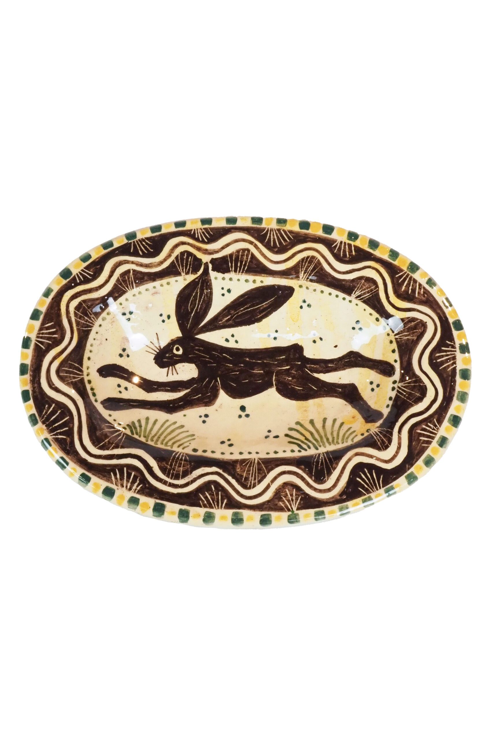 A Pottery Oval Hare Dish featuring a bounding hare and an intricately hand painted pattern. Exclusively hand moulded and decorated by Shun Clark for Wildmore.