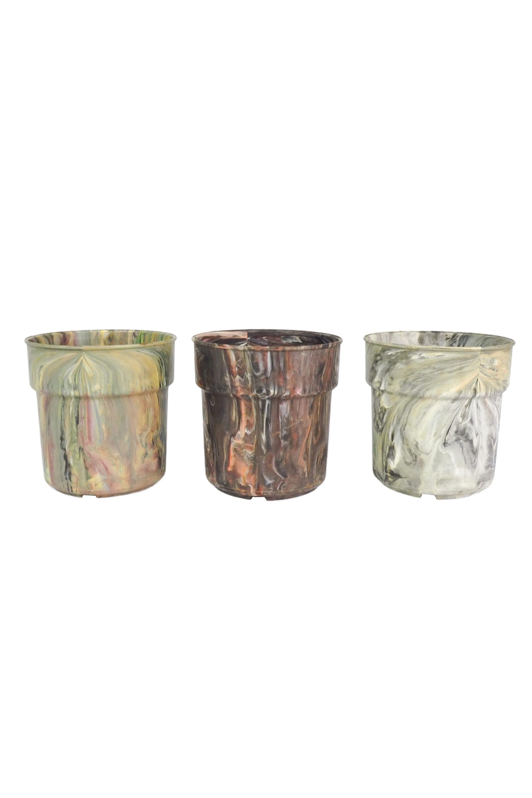 A rare trio of vintage 1970s planters. This curated collection of 3 Vintage Marbled Plant Pots have been curated from a rare collection of retro planters.