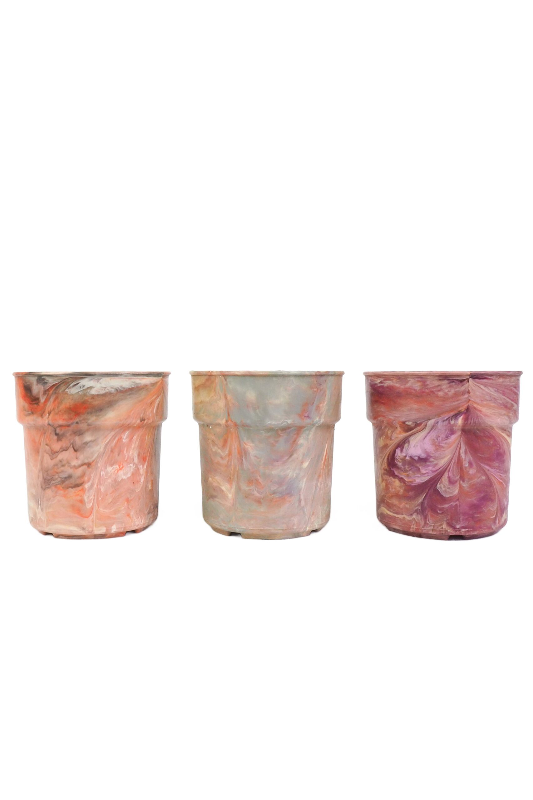 A rare trio of vintage 1970s planters. This curated collection of 3 Vintage Marbled Plant Pots have been curated from a rare collection of retro planters.