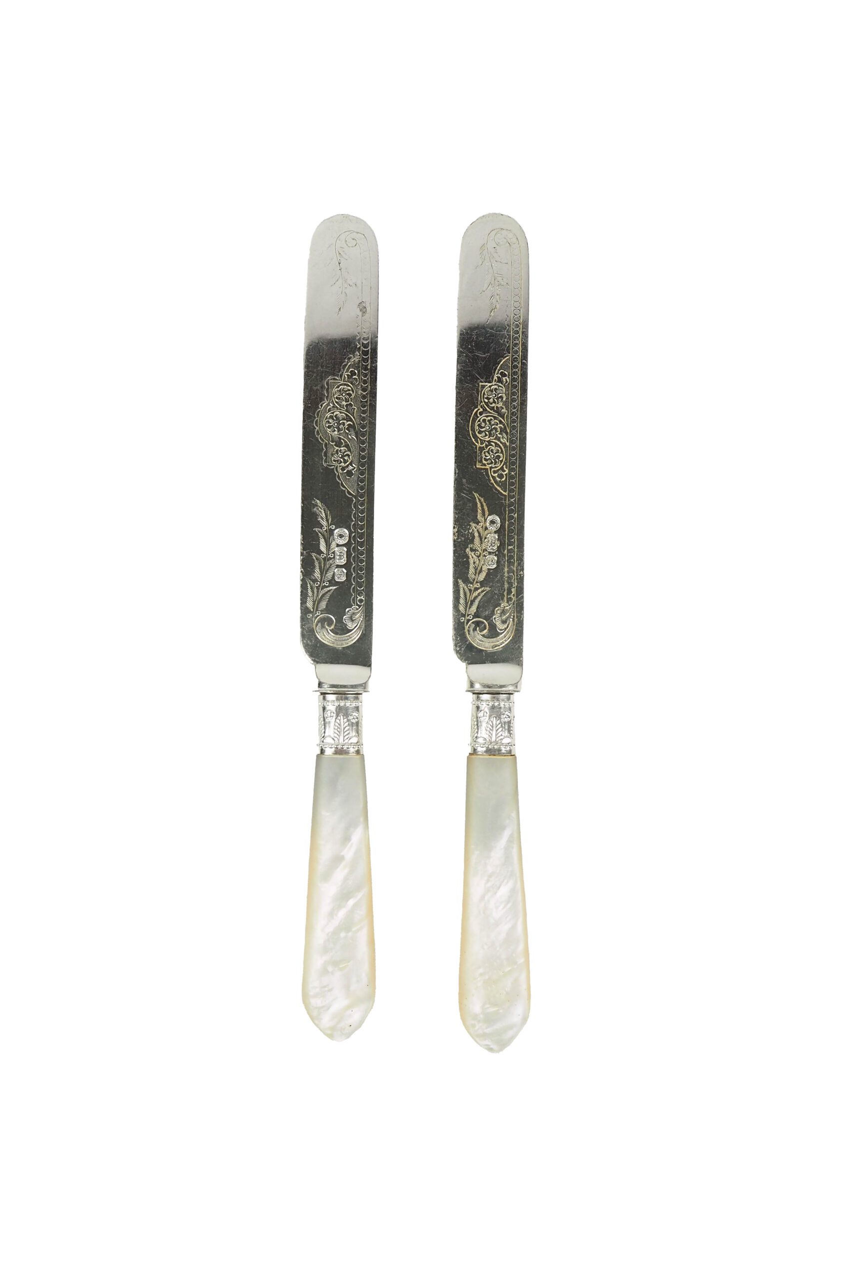 A Pair of Antique Silver Plate Knives with mother of pearl handles. Each knife has a blade with a beautifully etched floral pattern. Sourced for Wildmore