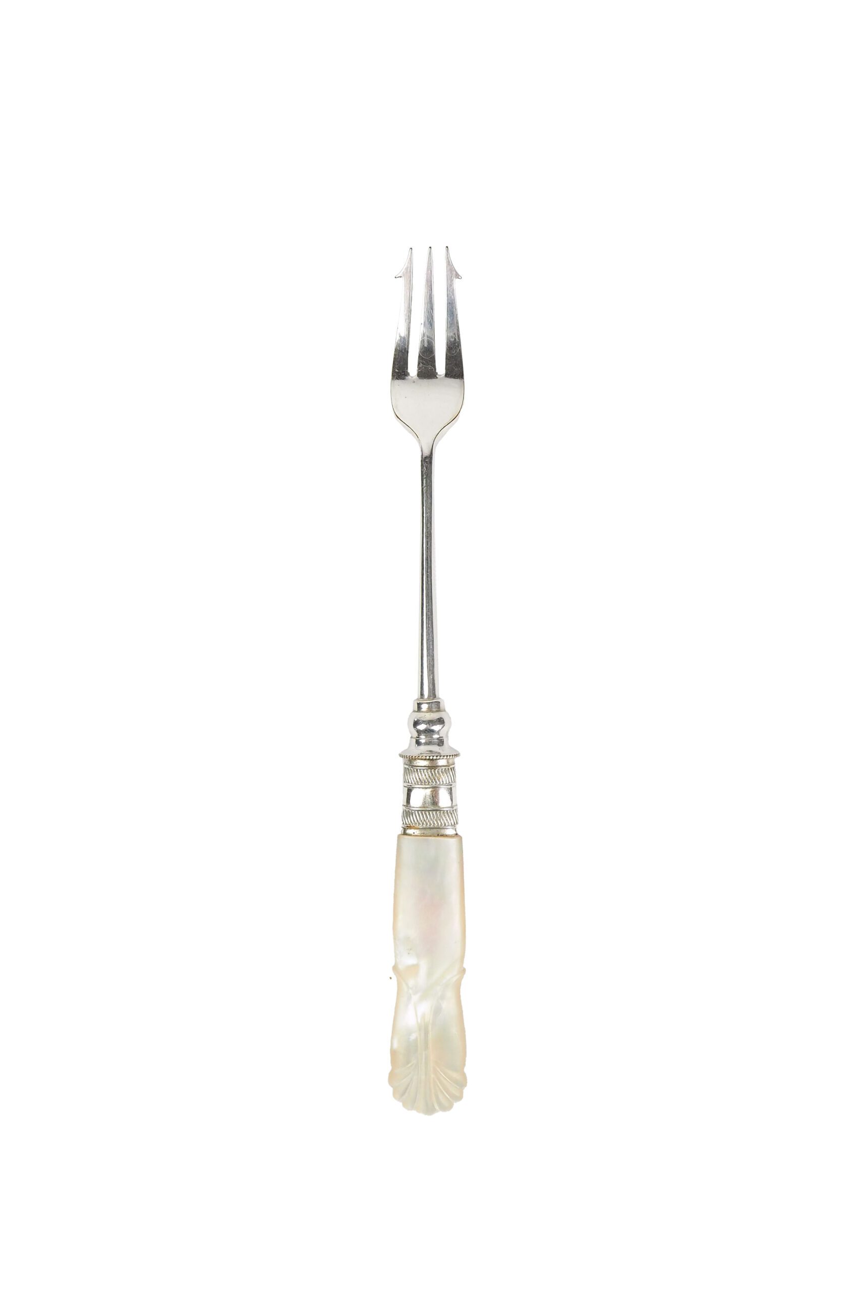 This Antique Pickle Fork has a beautiful Mother of Pearl handle, a Silver Plated neck and barbed prongs. Wildmore
