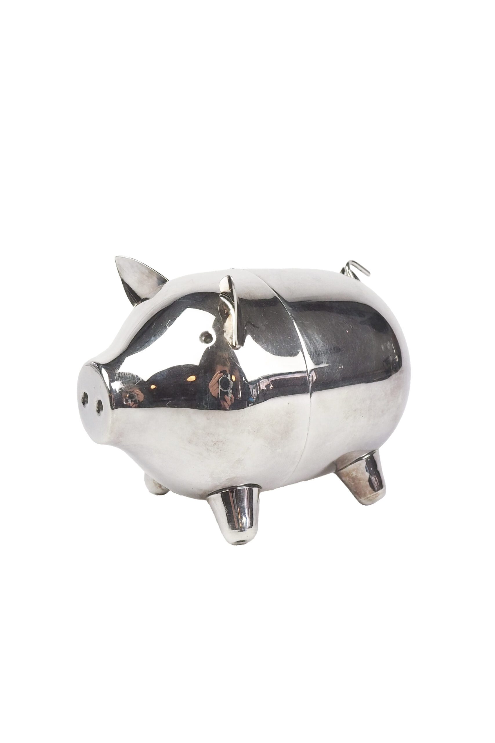 A wonderful Vintage Silver Plate Piggy Bank. This silver plated pig money box has a little curly tail and expressive ears. Wildmore
