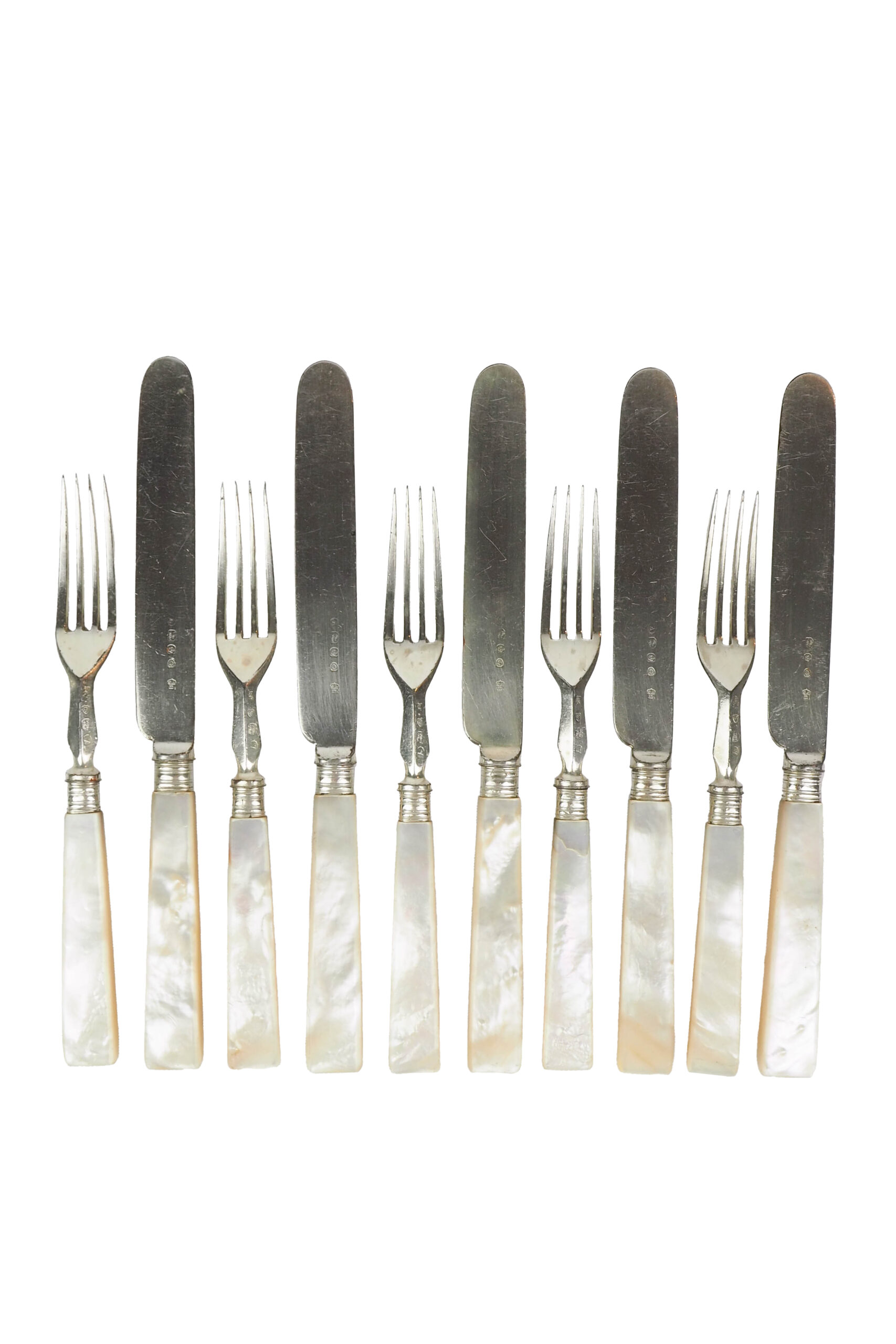 10 piece Antique Mother of Pearl Cutlery Set. The aged silver plate and mother of pearl handles give this set of knives and forks an antique look