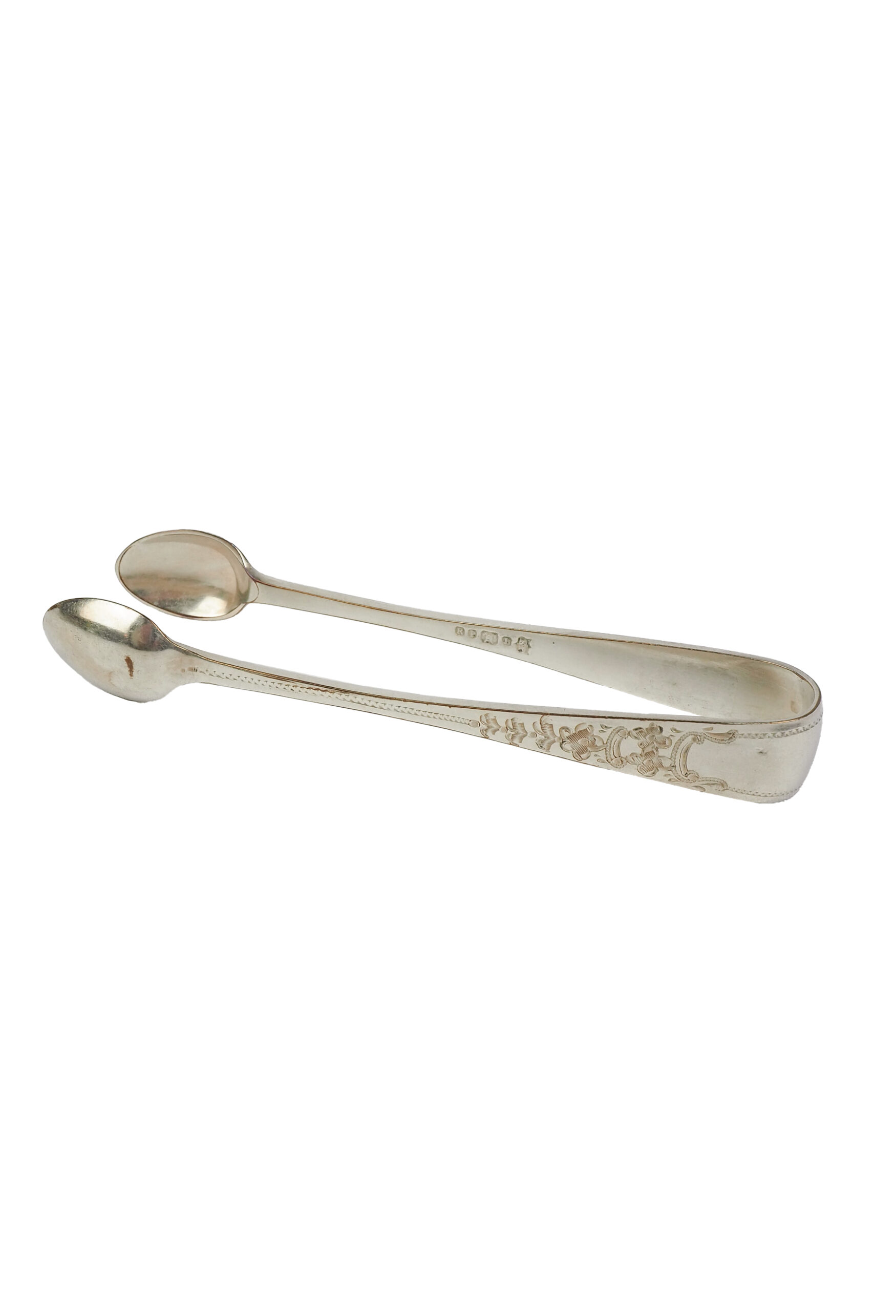 This Vintage Set of Silver Plate Sugar Tongs have a vintage stone washed patina to the silver plate and a decorative etched floral pattern. 
