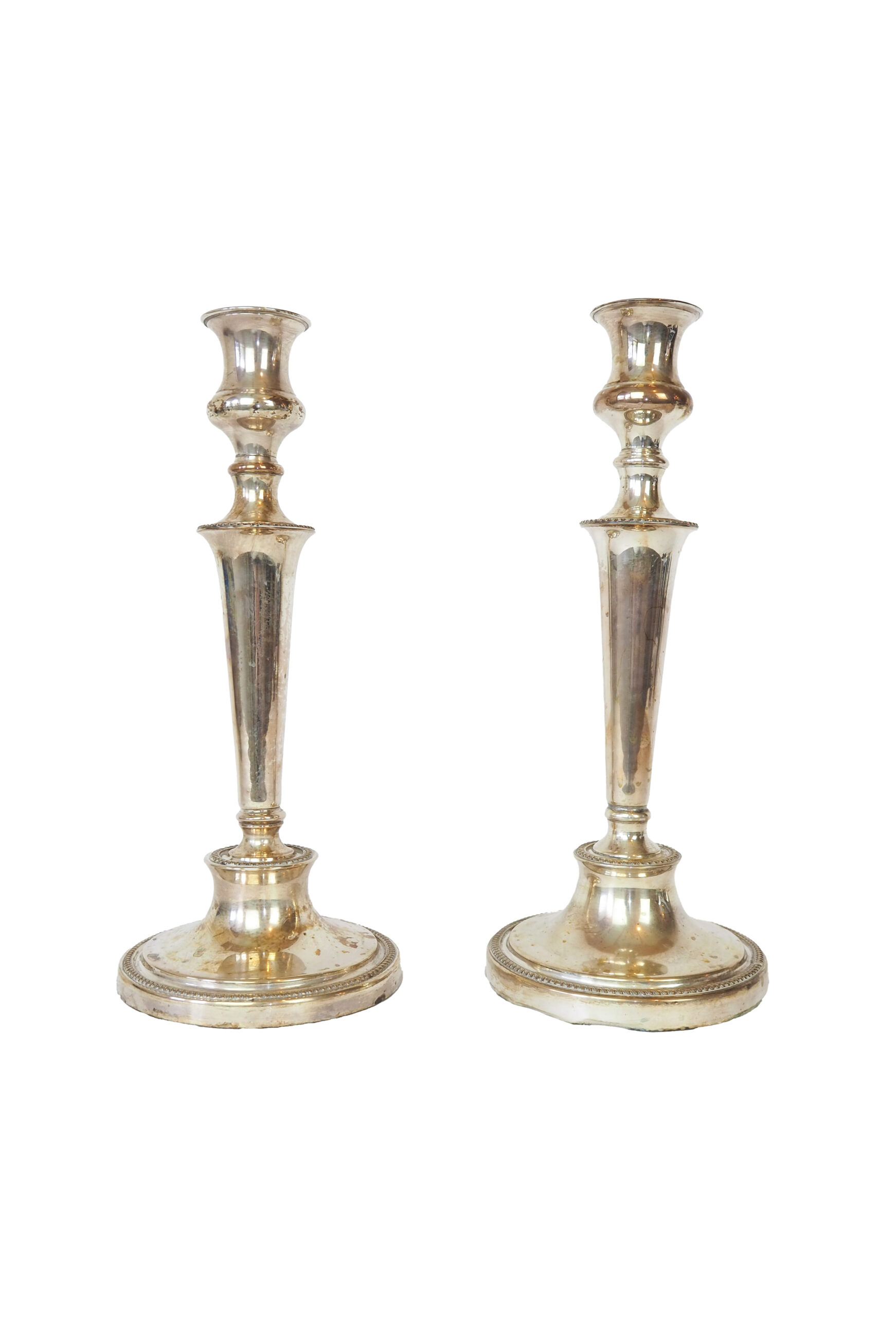 Stunning Pair of Georgian Silver Plate Candlesticks. This stunning pair of tall antique candle sticks are perfect for your coffee table or dinner party tablescape.